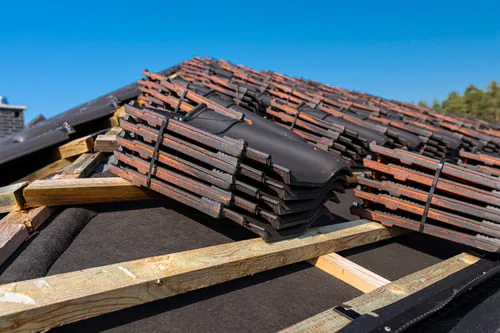 Roof tile staged on a New Mexico roof deck before installation